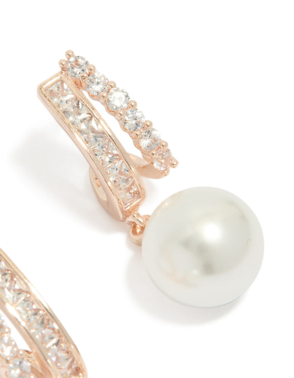 Highlighting rose gold plated cubic zirconia illusion pearl drop earrings with hoop closure in ivory showing craftsmanship post detail view