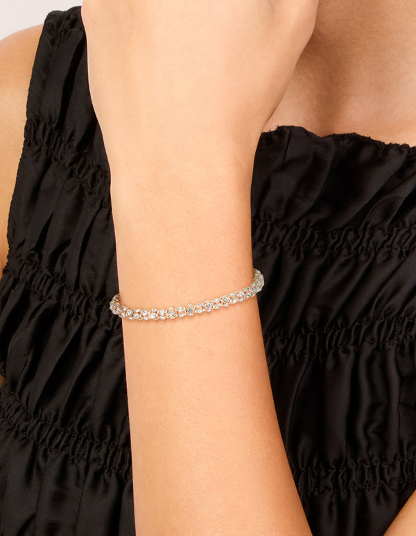 Featuring a rose gold plated diamante fireball bracelet on wrist view