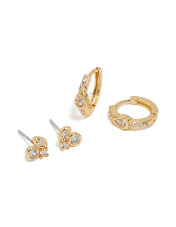 Crafted from gold plated material, this cubic zirconia trio stud and huggie earrings 2-pack front view