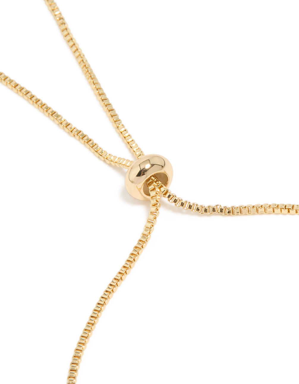 Detailed view of gold plated cubic zirconia double toggle bracelet with floral design closure detail view