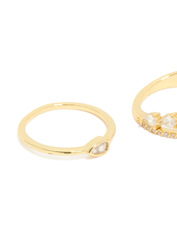 Crafted from gold plated material featuring cubic zirconia teardrop and band rings in a dainty 3-pack with crystal stones side detail view