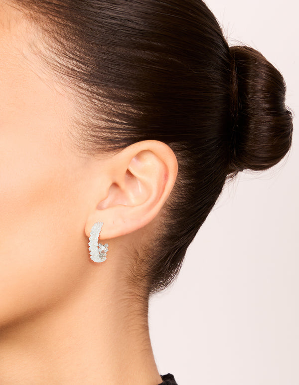 Elegant silver plated medium leaf hoop earrings with cubic zirconia on ear view