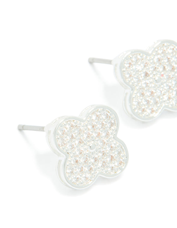 Highlighting dainty small floral stud earrings featuring silver plated metal and cubic zirconia in white close up view