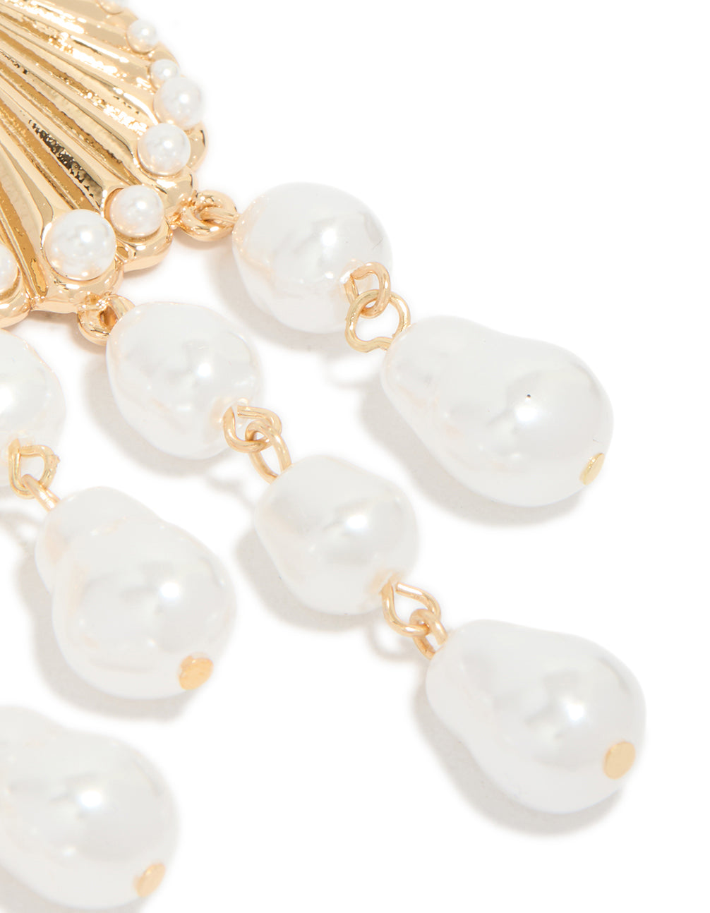 Highlighting gold ribbed shell and pearls drop earrings with ocean charm in statement style post detail view