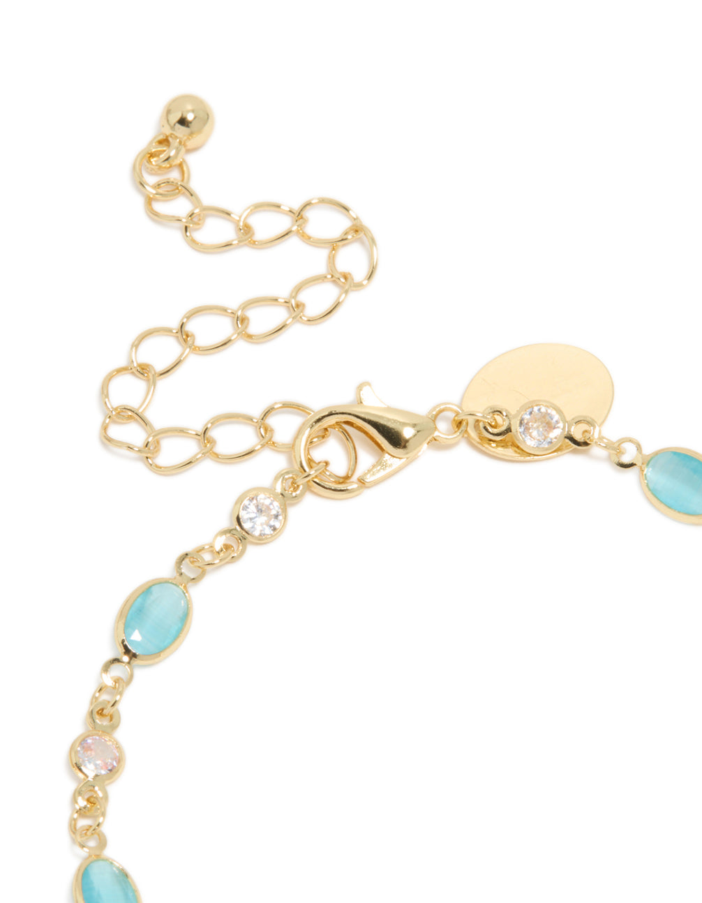 Stylish gold plated featuring blue and clear cubic zirconia oval bracelet with closure detail view