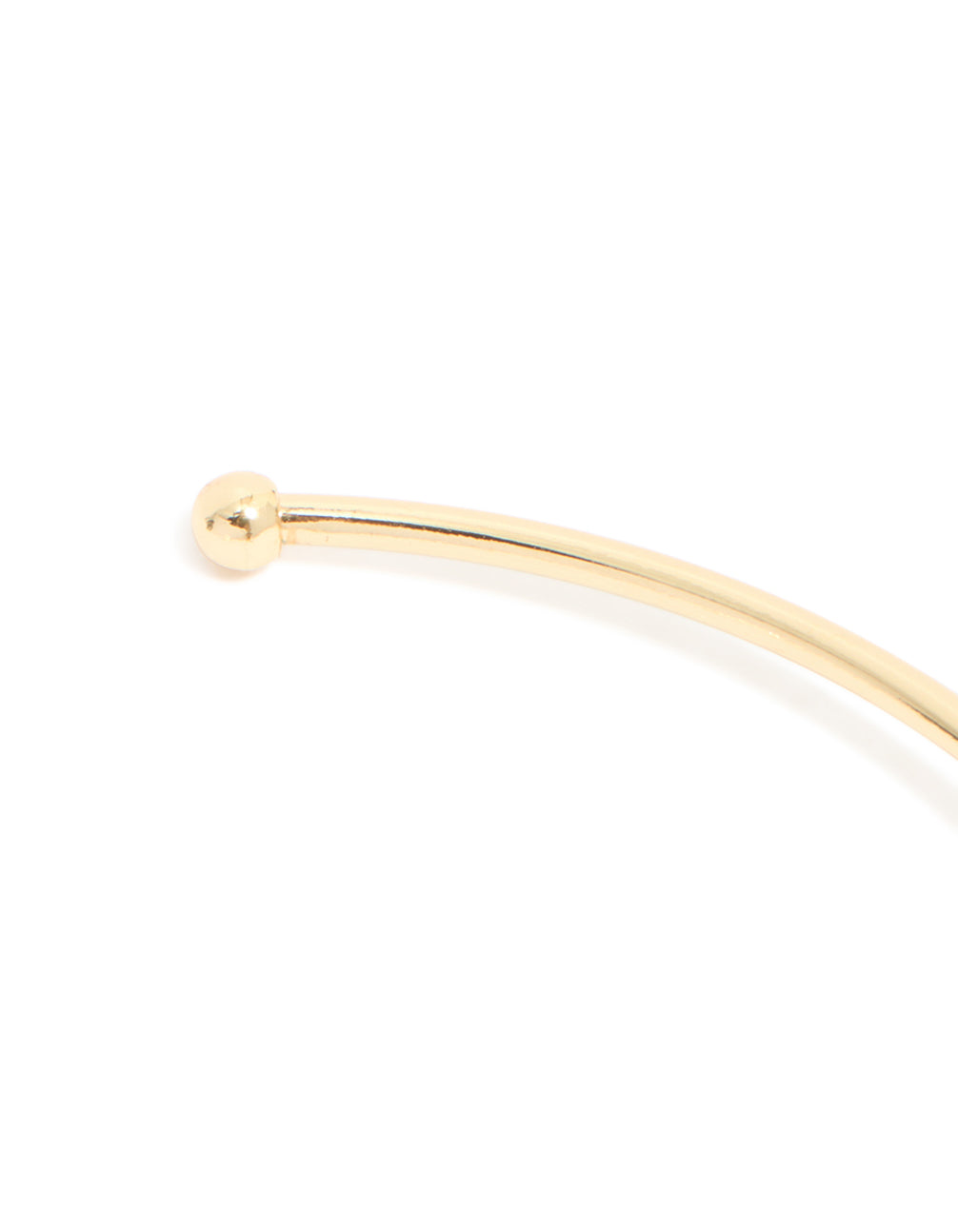 Crafted from gold plated material, this green cubic zirconia wrist cuff in a statement style, closure detail view