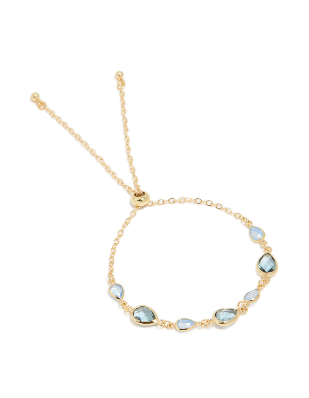 Featuring bracelet crafted from gold plated metal with deep blue cubic zirconia stones in a statement design front view