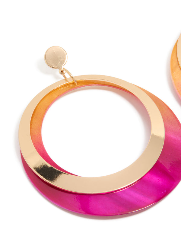 Featuring gold two tone pink shell open disc drop earrings in a close up view