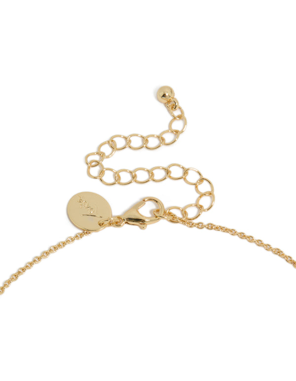 Presenting a gold plated July birthstone necklace featuring a cubic zirconia pendant in a dainty statement style, clasp detail view