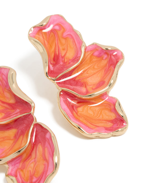 Detailed view of small half flower earrings featuring enamel in light pink, orange, and hot pink tones with gold post detail view