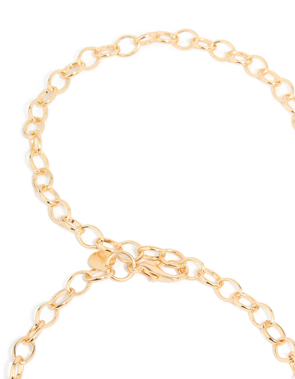 Crafted with embellished sun ,this gold statement waisted belt shown in a detail view