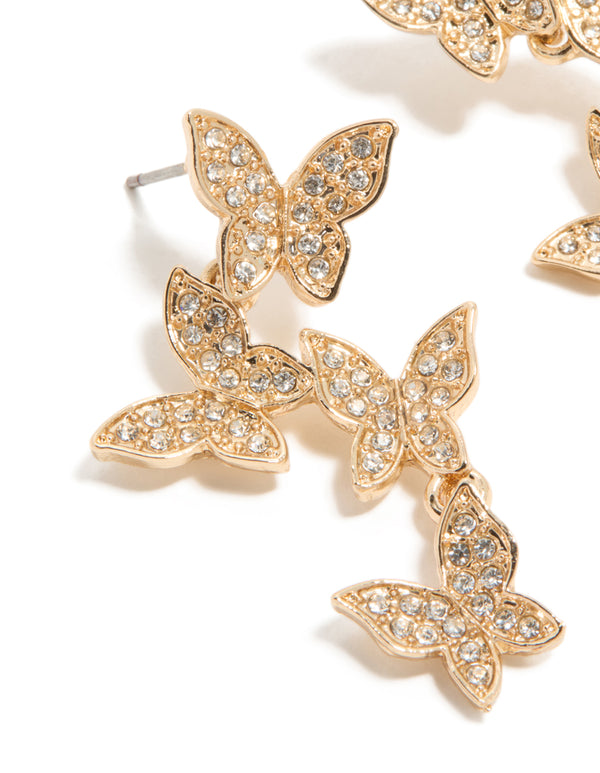 Crafted with gold diamante butterfly feature drop earrings in statement close up view