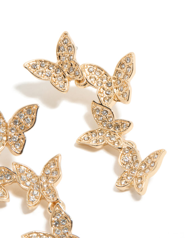 Crafted with gold diamante butterfly feature drop earrings in statement close up view