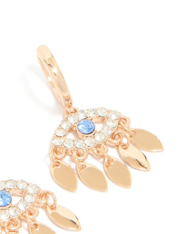 Designed with statement evil eye charm accents, these gold huggie earring post detail view