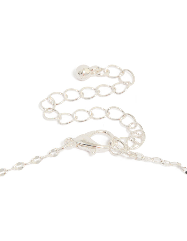 Detailed look at vintage cross charm pendant necklace with silver plated finish and statement style clasp detail view