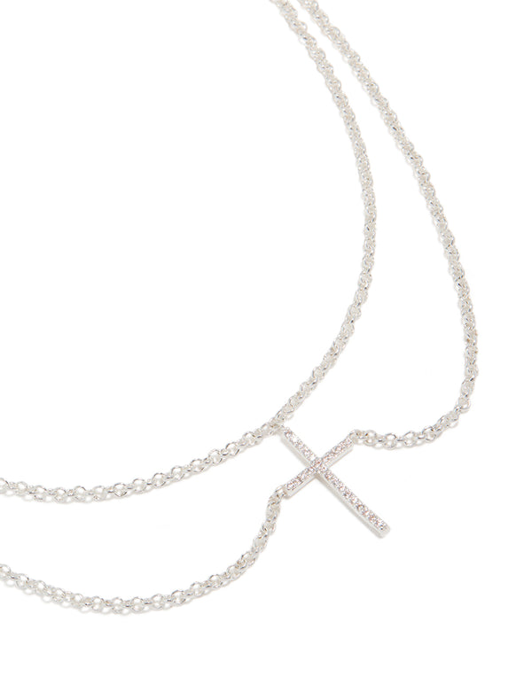 Showcasing a silver plated layered necklace with cubic zirconia cross pendant front view