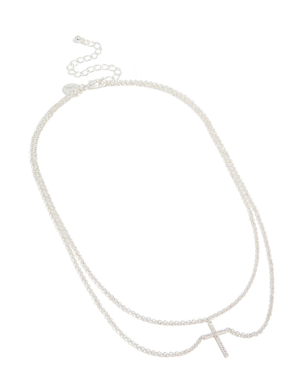 Featuring a silver plated layered necklace with cubic zirconia cross pendant close up view