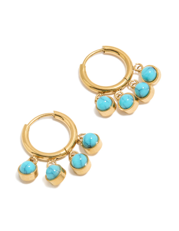 Showcasing chunky huggie earrings featuring charm details, crafted from waterproof stainless steel and turquoise in finished with gold plating front view