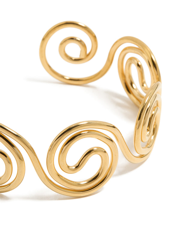 Crafted from waterproof gold plated stainless steel swirl bendy wrist cuff bangle in statement styling close up view