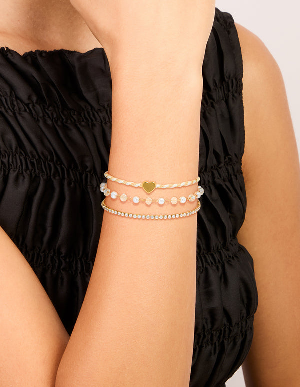 Beautifully crafted waterproof gold plated stainless steel pearl, cord and tennis bracelet with beads, heart and pearl, cubic zirconia in dainty style on wrist view