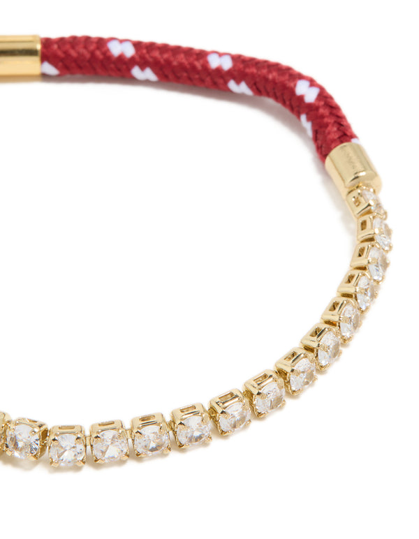 Highlighting waterproof bracelet in gold plated stainless steel featuring half tennis section with red and white braided cord close up view
