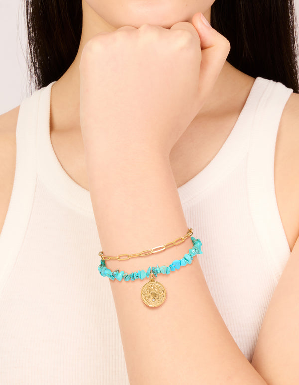 Showcasing waterproof stainless steel bracelet with turquoise chip beads, coin detailing, and gold plated finish on wrist view