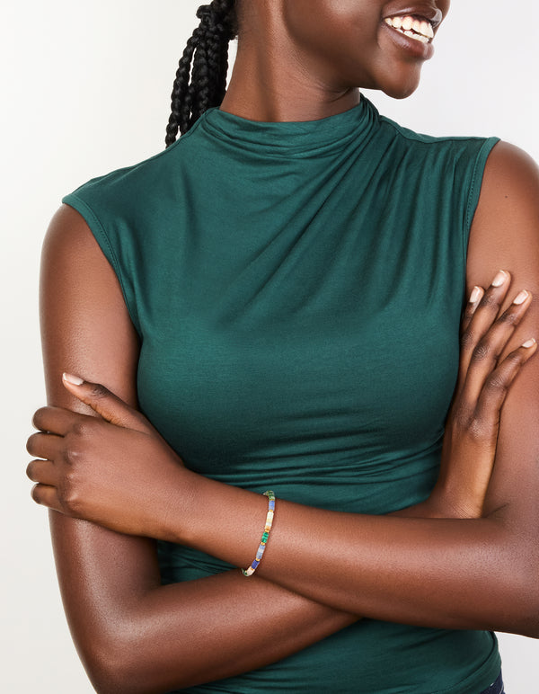 Stylish waterproof gold plated stainless steel beaded bracelet featuring amazonite and rose quartz semi precious stones with round cut on model view