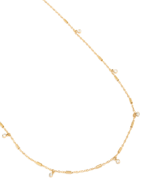 Presenting a waterproof body chain featuring charm details, crafted from gold plated stainless steel with cubic zirconia in a dainty style close up view