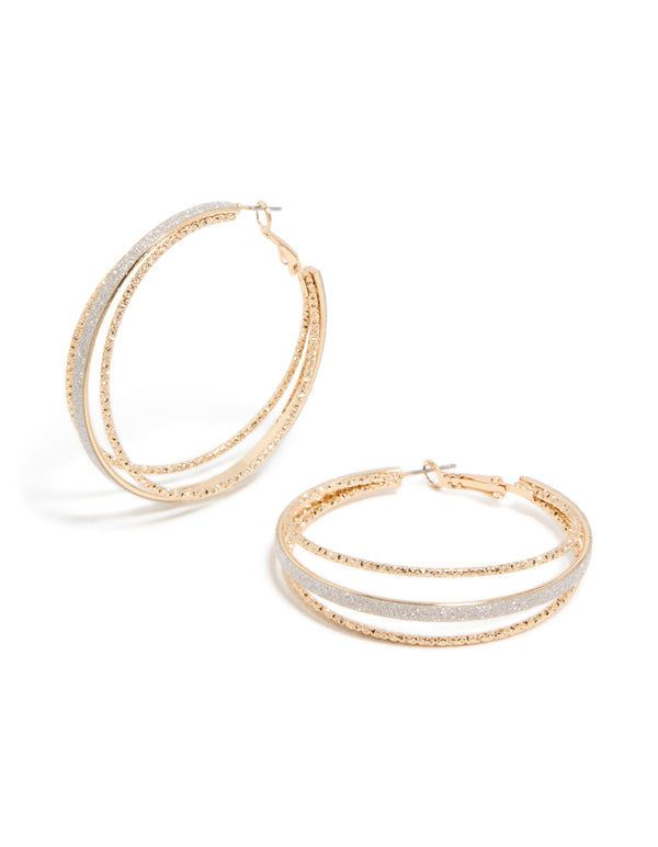 Featuring textured split glitter hoop earrings in gold with statement style front view