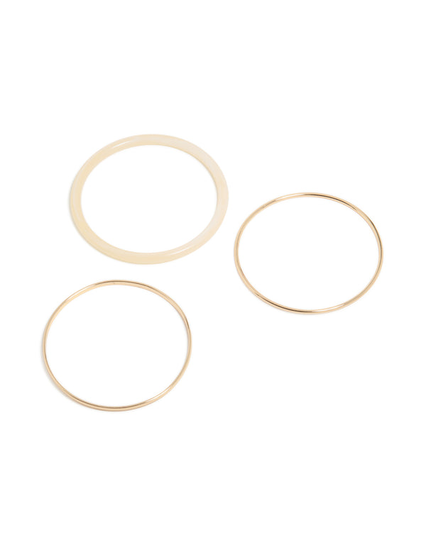 Showcasing a trio of simple acrylic bangle in a 3-pack, crafted in gold tones front view