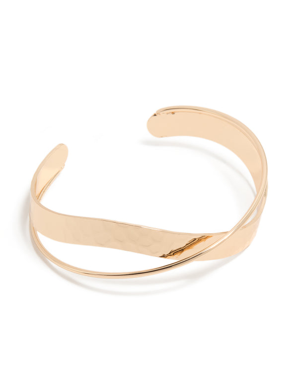 Showcasing a gold twisted wrist cuff front view