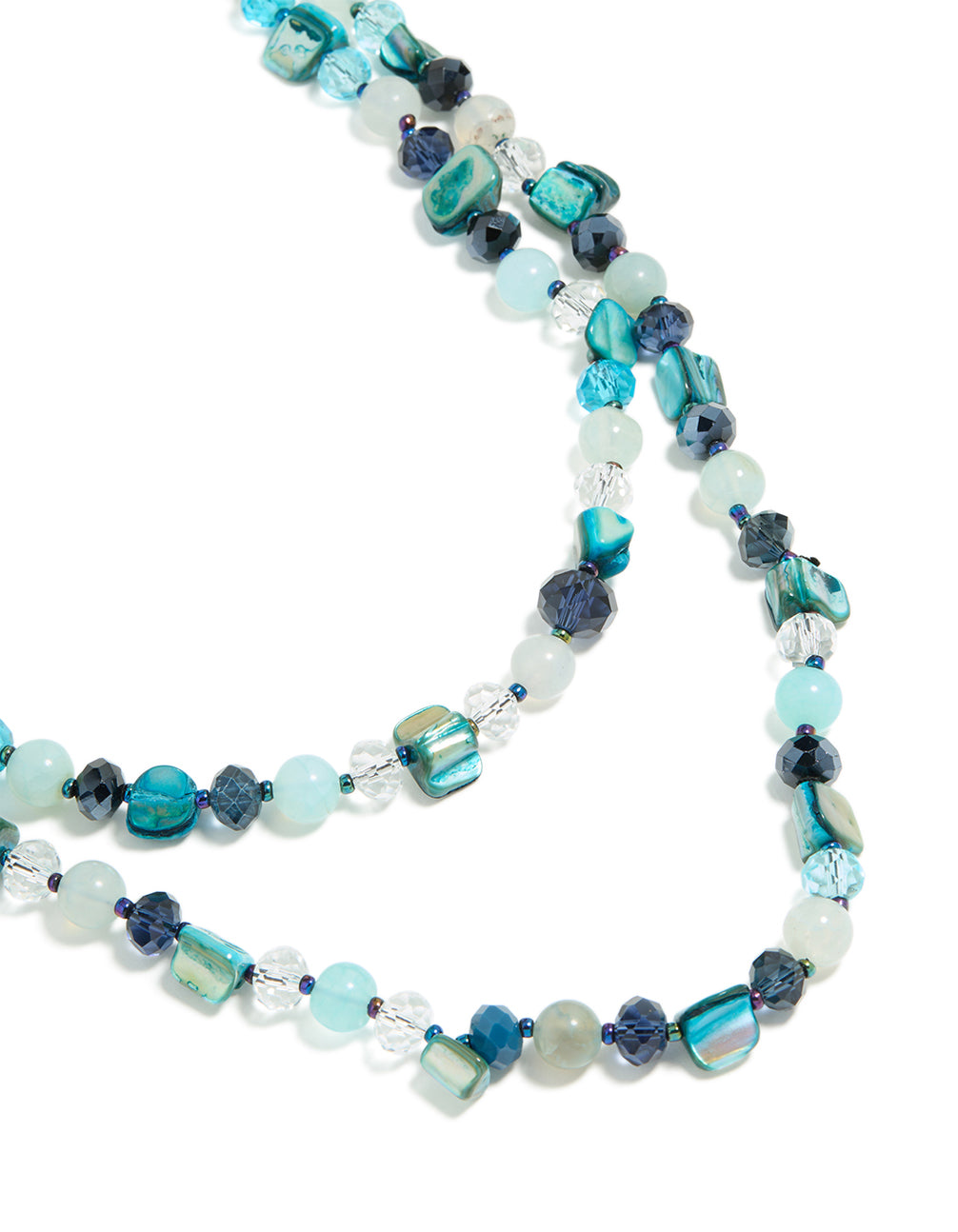 Showcasing an irregular double layered statement necklace with beads, ocean-inspired detailing in turquoise, navy, pale turquoise, and teal close up view