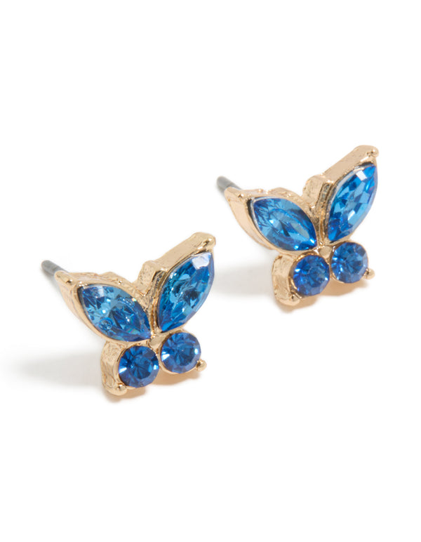 Showcasing dainty butterfly stud earrings in gold with blue diamante stones front view