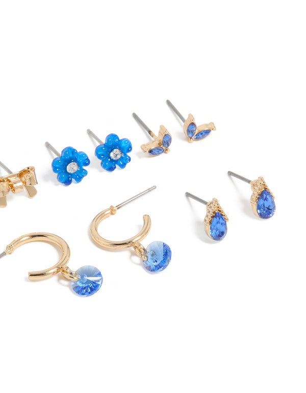 Crafted with gold blue diamante earrings 7-pack featuring flower and bow elements with huggie and stud closures post detail view