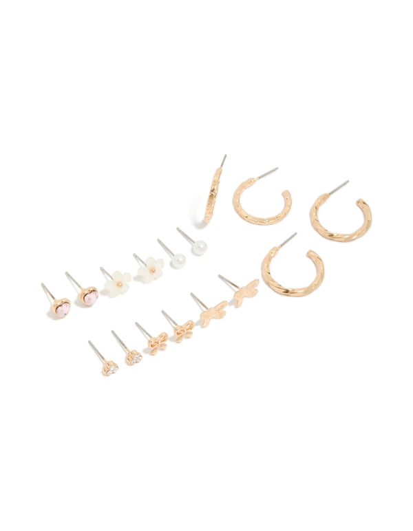 Showcasing gold earrings 8-pack featuring bow, heart, pearl and butterfly details with stud and hoop closure in ivory, pink, and silver accents front view