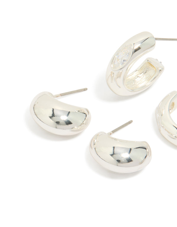 Showcasing silver plated cubic zirconia bezel and chubby open hoop earrings in a 2-pack close up view