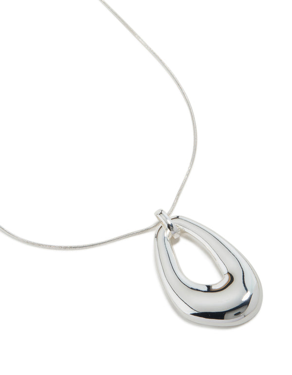 Discover this long organic pendant necklace crafted from plated material in a polished finish close up view