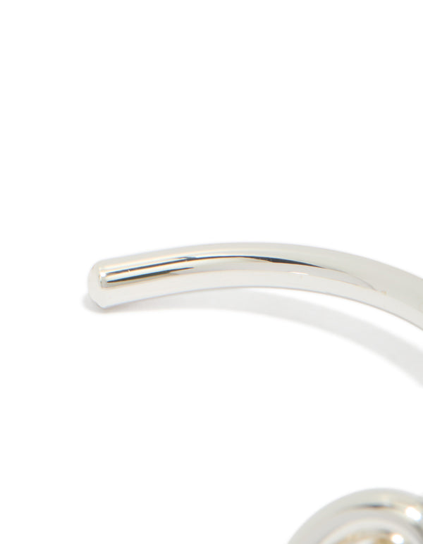 Presenting a dainty bangle crafted from silver plated metal featuring knotted wrist cuff design closure detail view