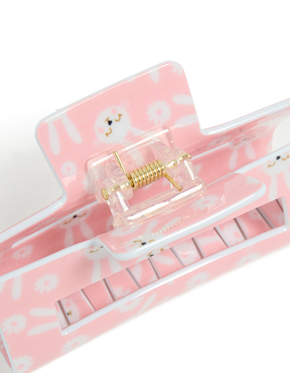 Designed with floral and animal elements, this kids pink acrylic bunny print claw clip showcases white and gold hardware detail view