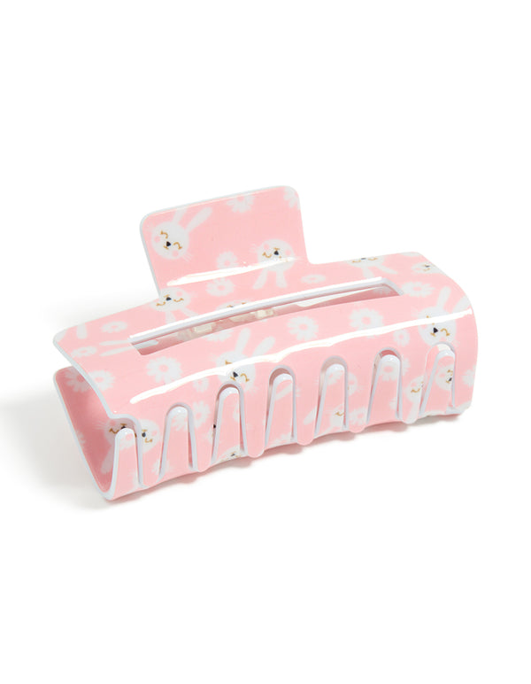 Beautifully crafted kids pink acrylic bunny print claw clip featuring floral and animal details with white and gold accents front view