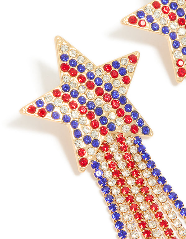 Featuring gold red clear and blue diamante cup chain star drop earrings with celestial design and tassel in statement style close up view