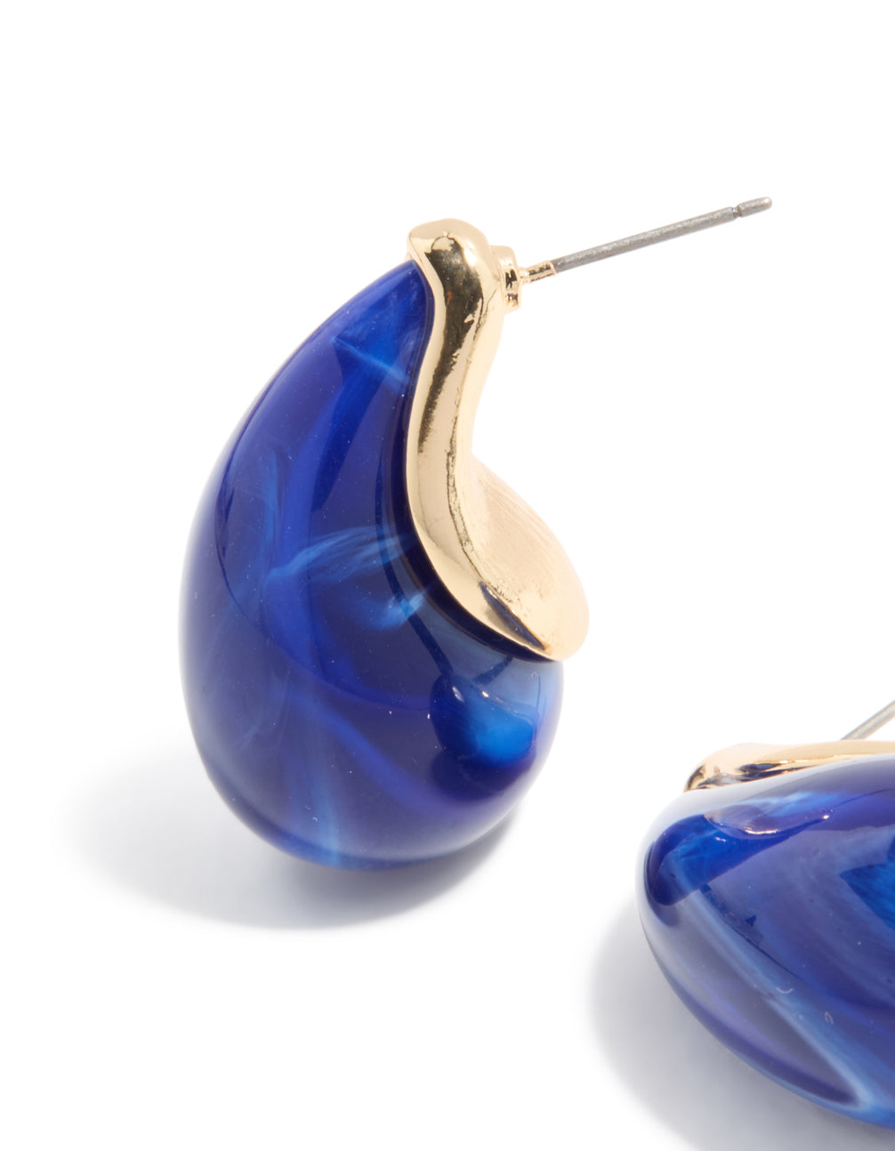 Elegant gold pear drop earrings in blue stone design close up view