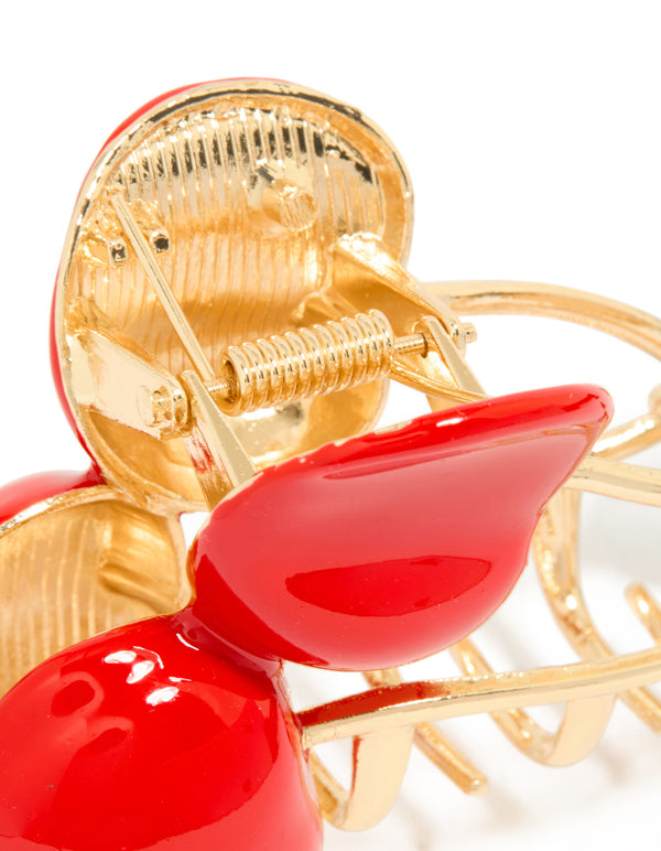 Crafted cherry claw clip with fruit and leaf design in solid gold detail view