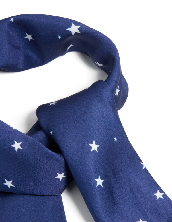 Stylishly designed celestial novelty print fabric scarf in navy and white featuring star motifs detail view