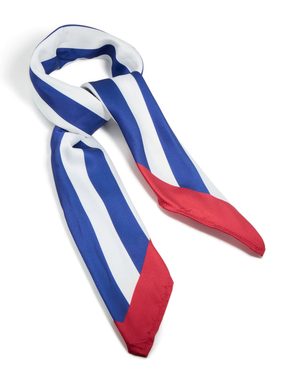 Showcasing a striped fabric scarf in royal blue and white with red accents side view