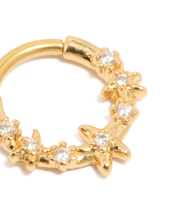 Showcasing a ocean starfish clicker ring in gold plated surgical steel with cubic zirconia accents and a dainty design detail view