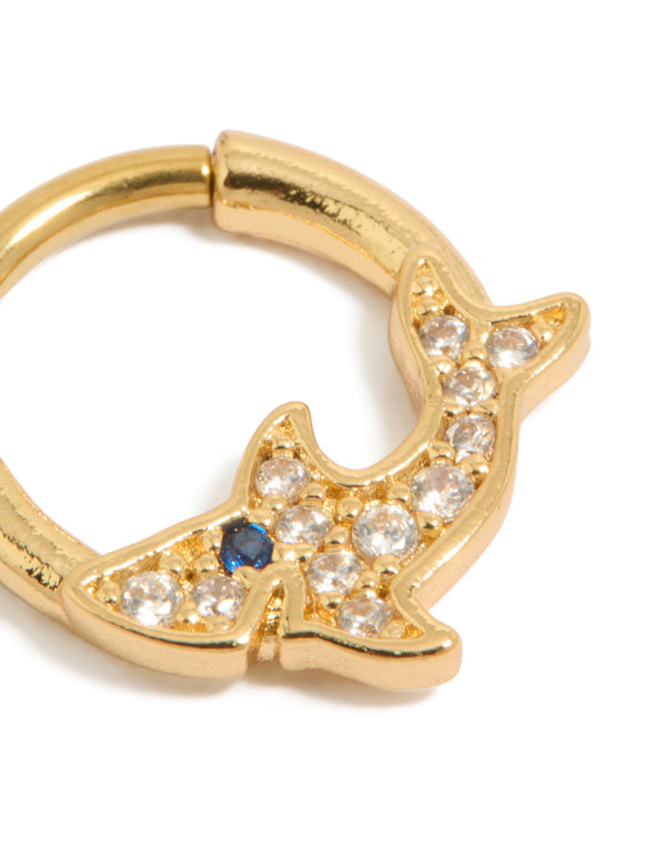 Highlighting a statement shark clicker ring made from surgical steel with cubic zirconia embellishments in gold plated finish featuring ocean motif detail view