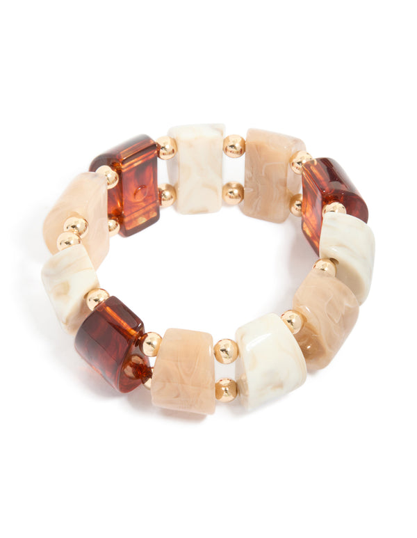 Showcasing a brown and cream acrylic beaded stretch bracelet featuring alternating rectangular beads in beige ivory saddle brown with gold spacer balls accents front view