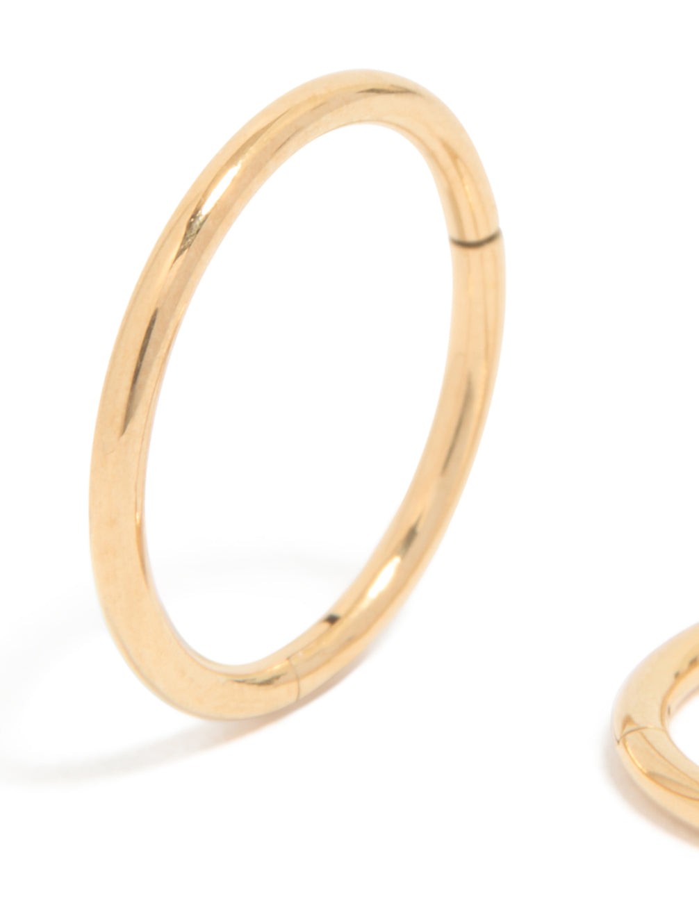 Featuring gold plated titanium 10MM thick sleeper hoop earrings close up view