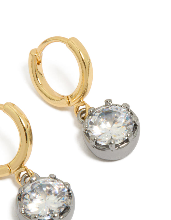 Showcasing mixed metal plated cubic zirconia huggie drop earrings featuring gold and silver finish post detail view
